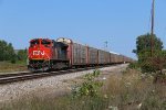 CN 8834 waits to proceed through Milwaukee Junction with E271